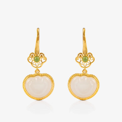 Nephrite and 24K Gold Ruyi Earrings featuring intricate design with a white nephrite heart-shaped pendant and delicate green jade accents, suspended from 24K gold.