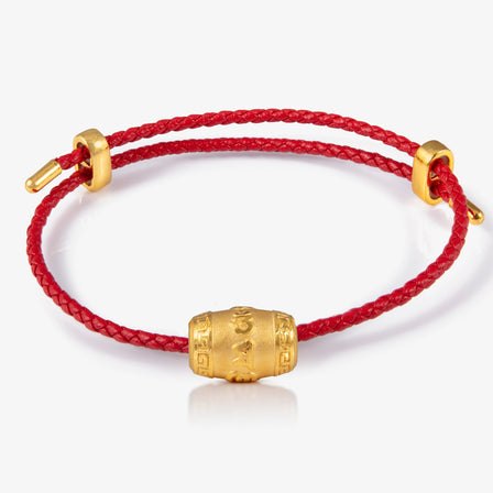 24K gold charm engraved with Six Syllable 

六字真言转运珠，红绳金饰

Buddhist mantra gold bead on red cord

Gold cylinder prayer bead charm for compassion and clarity