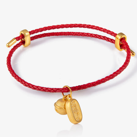 24K gold bell with blessing charm for protection

金铃铛与金牌串饰，象征平安与祝福

gold charm with traditional meaning

Small bell talisman in 24K gold for everyday wear