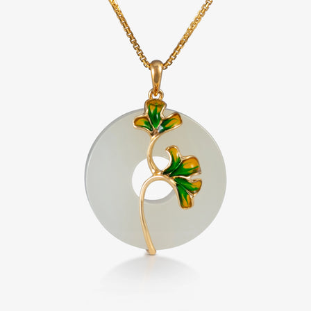  Nephrite peace buckle with green and yellow ginkgo leaf enamel accents set in 18K yellow gold.