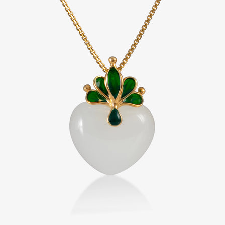 Heart-shaped nephrite pendant with 18K gold detailing and green enamel crown.