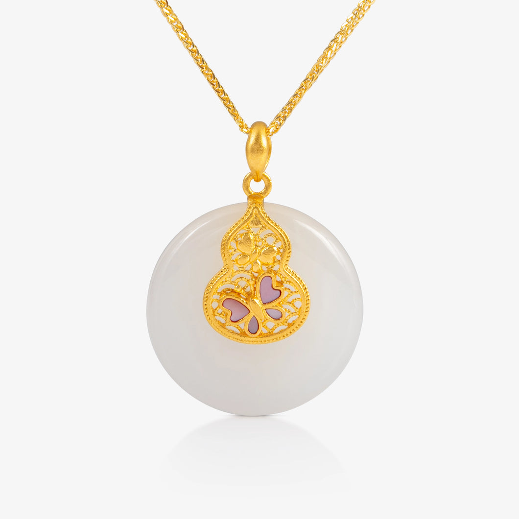 A nephrite peace buckle pendant featuring an intricate 24K gold filigree hulu and butterfly motif.