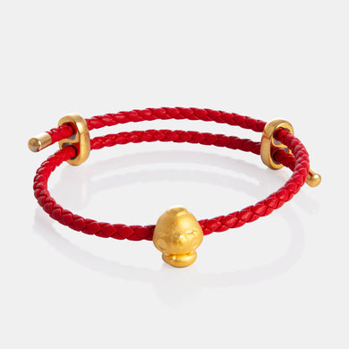 24K Gold Snake Charm on a red leather bracelet