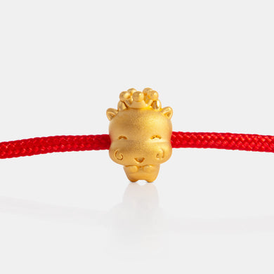 24K Gold Ox Charm on a red knot bracelet