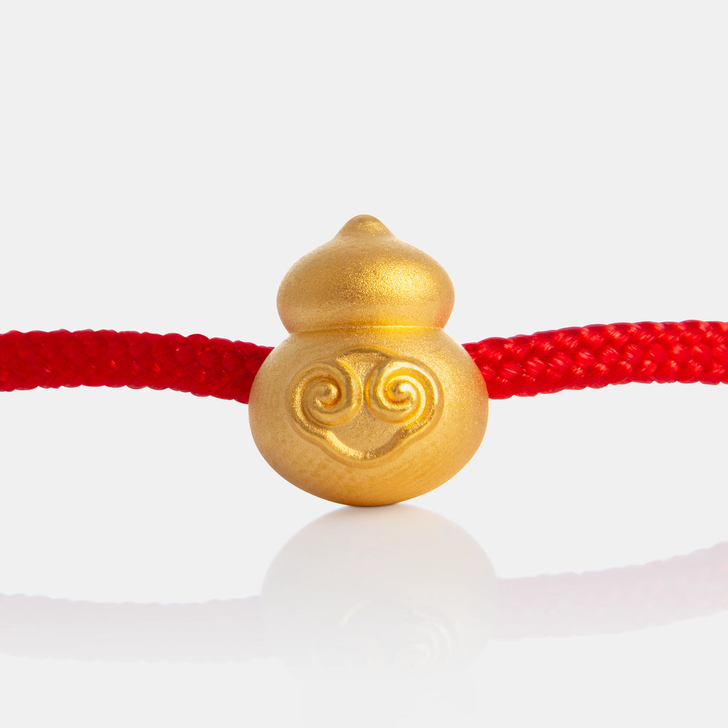 24K Gold Hulu Charm on a red knot bracelet