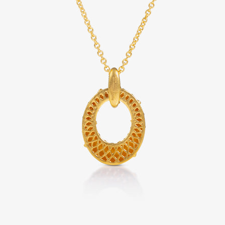 Gold necklace with a intricate pendant on a white background